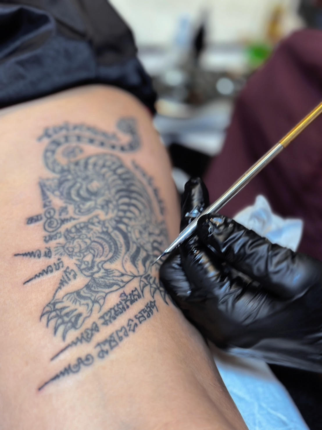 Traditional Sak Yant tattoo being applied