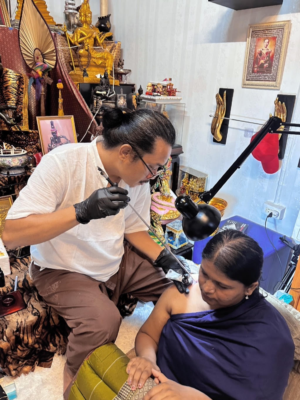 Sak Yant tattoo session at the studio