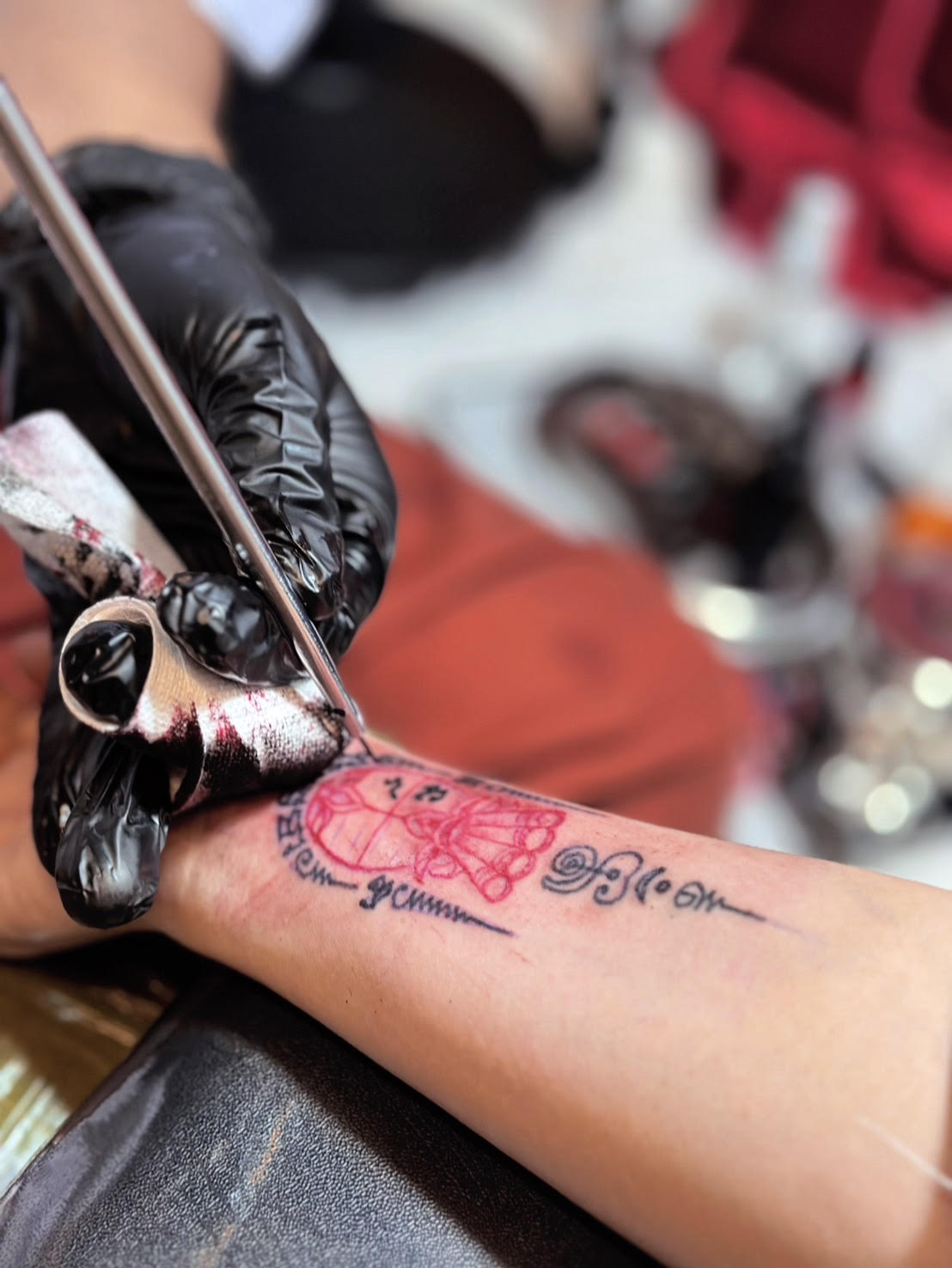 Close-up of Sak Yant tattooing process