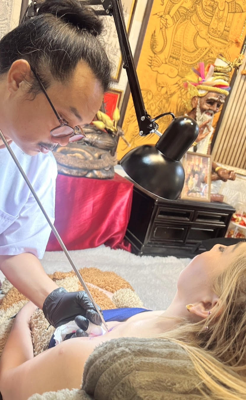 Ajarn Thong performing Sak Yant tattoo